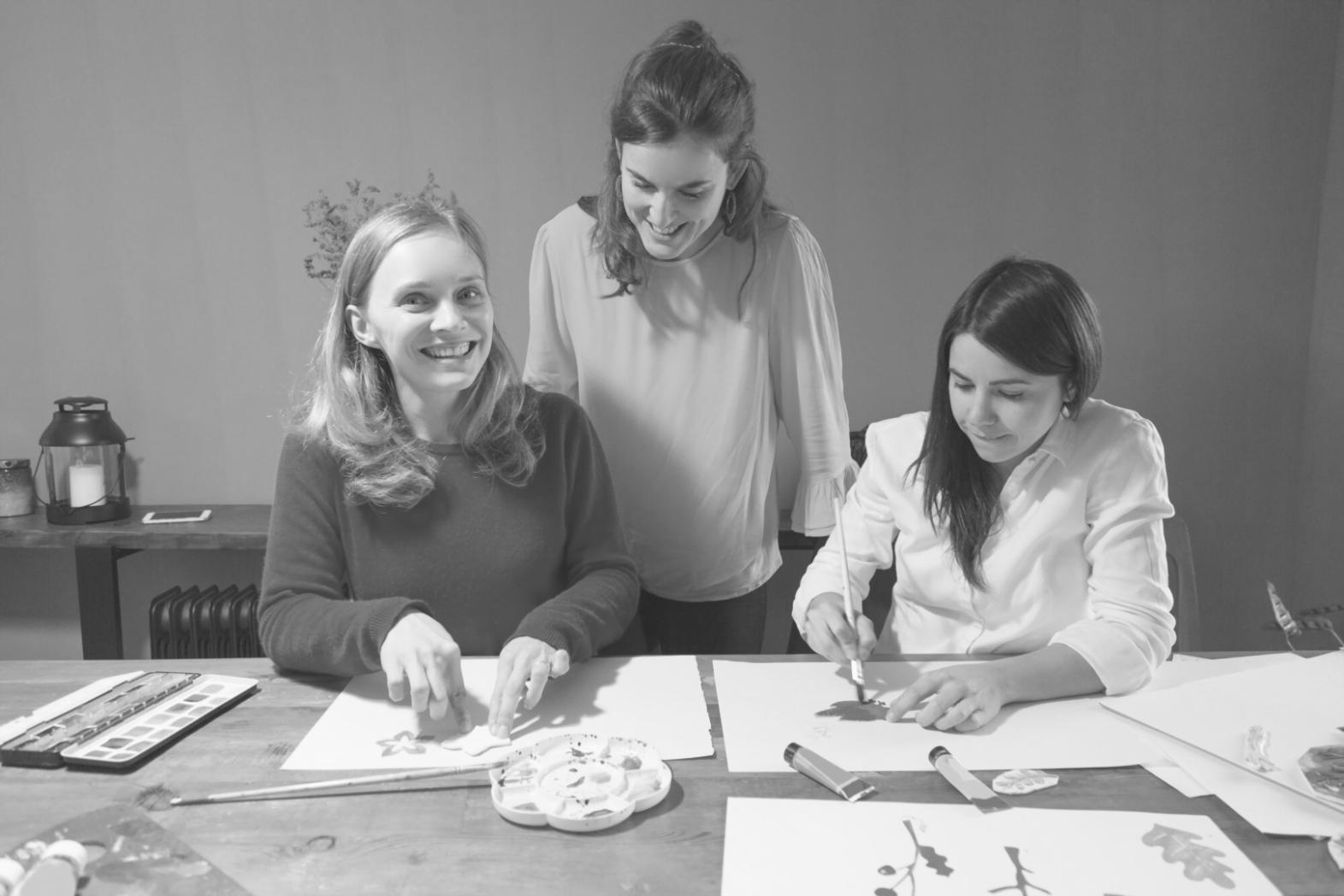 Instructor reviewing budget variance reports with students